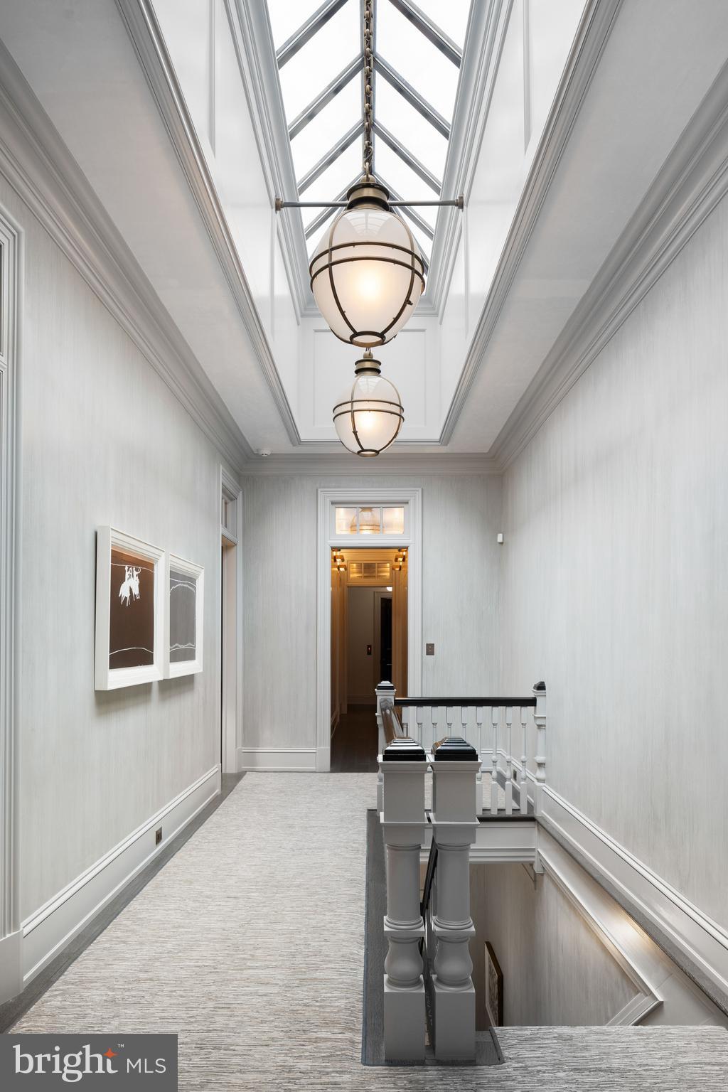 2041 Delancey Street Philadelphia, PA 19103 - Photo 24 of 29 a view of a hallway with a livingroom and chandelier