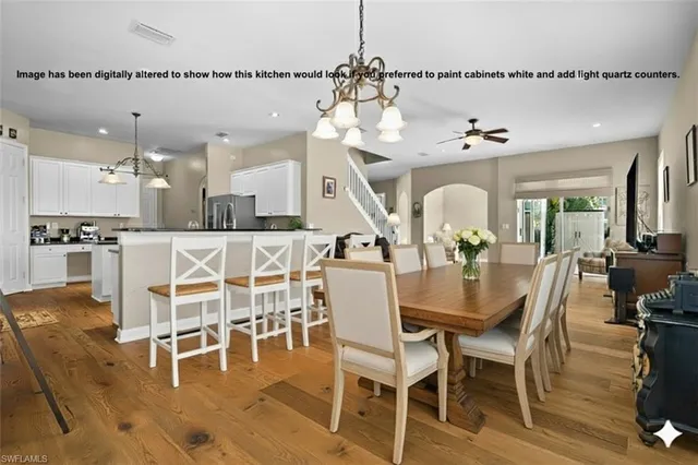 a kitchen with stainless steel appliances granite countertop a stove a sink dishwasher and a refrigerator