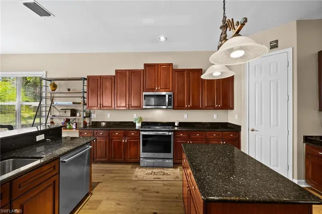 a spacious bedroom with a bed and a couch