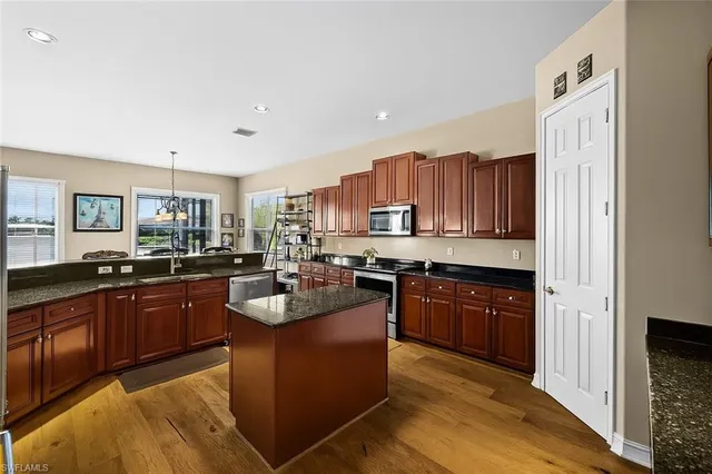 a living room with furniture and a mirror