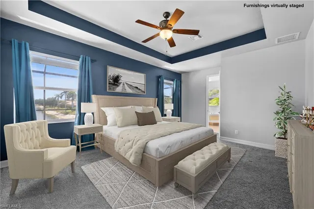 a view of a hallway with a bedroom and windows