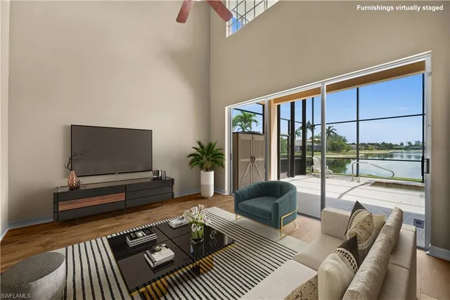 a living room with furniture and a book shelf