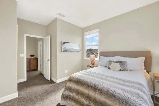 a bedroom with a bed and closet