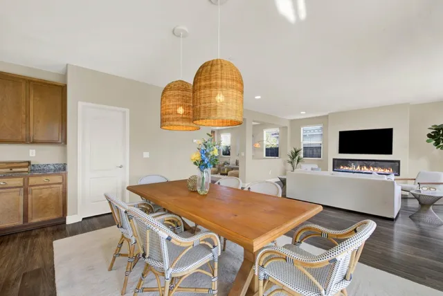 a view of a dining room with furniture window and wooden floor