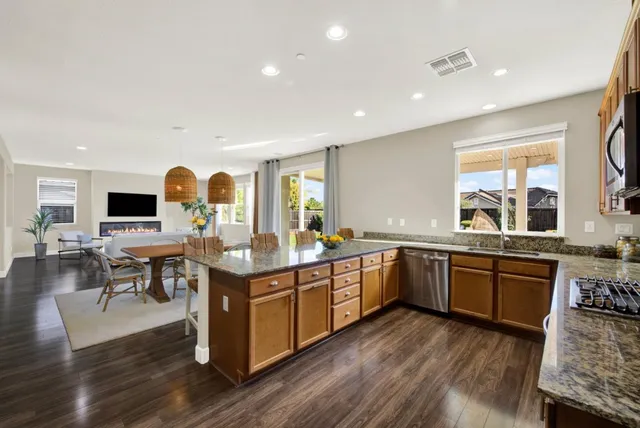 a kitchen with lots of counter top space and stainless steel appliances