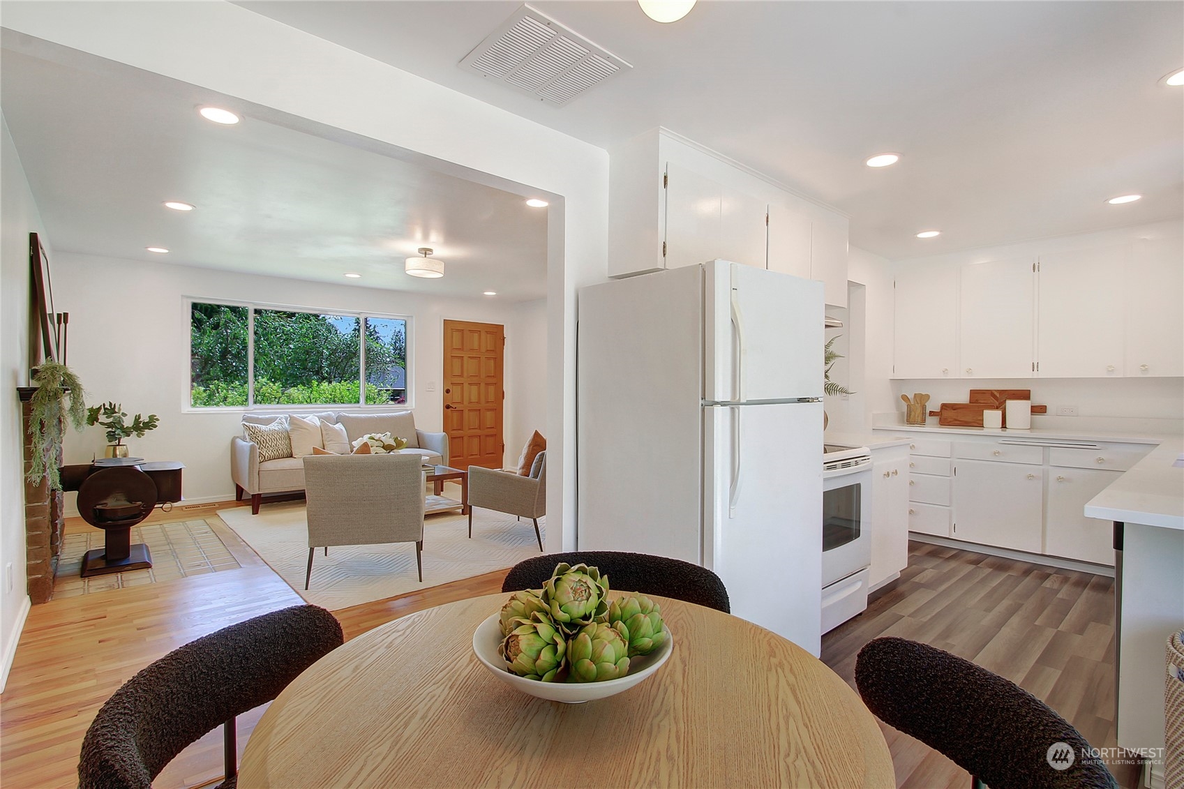 7 232nd Place Southwest Bothell, WA 98021 - Photo 8 of 30 a living room with stainless steel appliances furniture wooden floor and a kitchen view