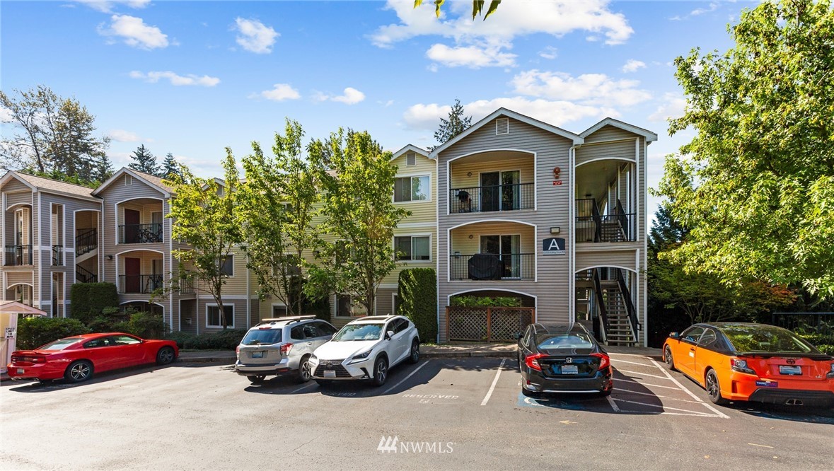 10709 Valley View Road, Unit A301 Bothell, WA 98011 - Photo 1 of 26 a car parked in front of a house