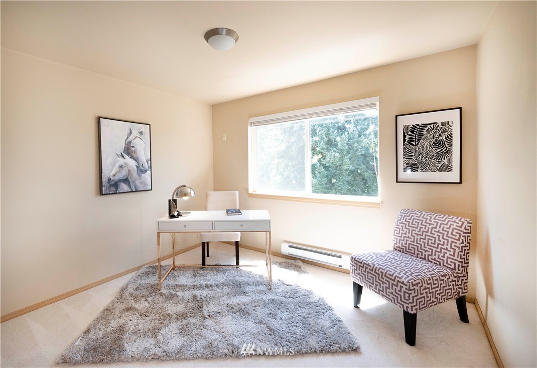 10709 Valley View Road, Unit A301 Bothell, WA 98011 - Photo 17 of 26 a living room with furniture and a window