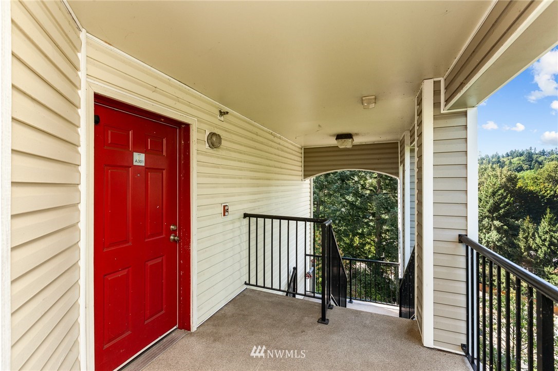 10709 Valley View Road, Unit A301 Bothell, WA 98011 - Photo 20 of 26 a view of a porch with a door and chair