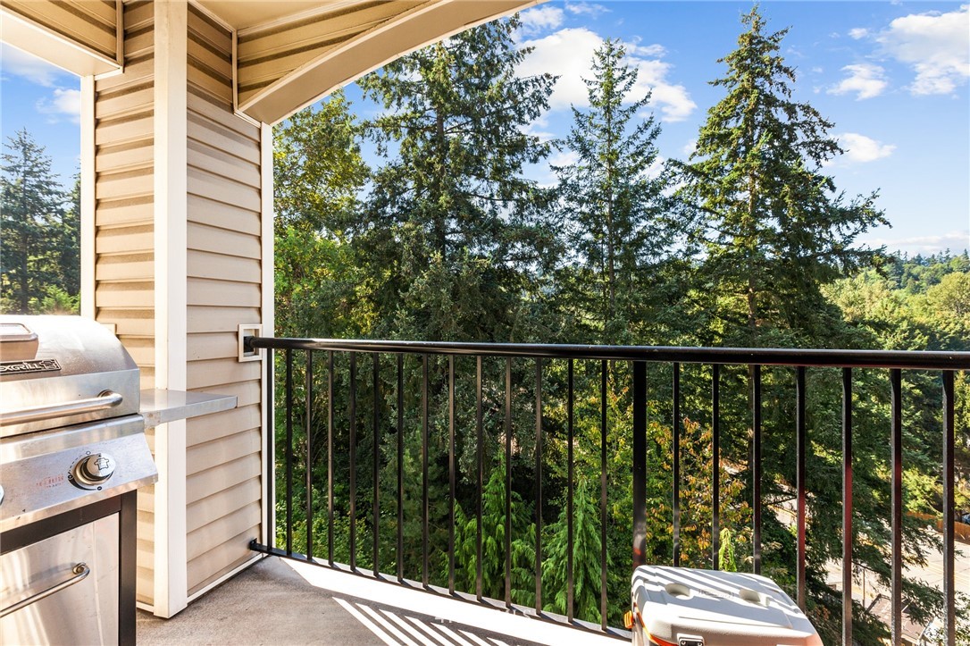 10709 Valley View Road, Unit A301 Bothell, WA 98011 - Photo 21 of 26 a balcony with a yard