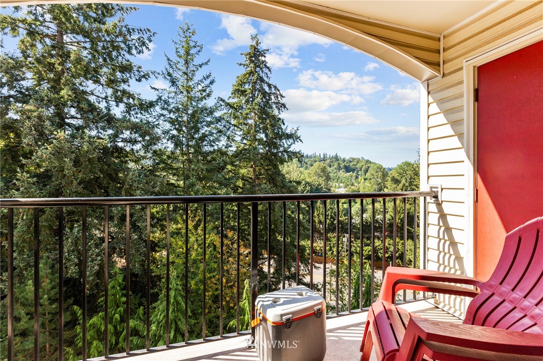 10709 Valley View Road, Unit A301 Bothell, WA 98011 - Photo 22 of 26 a view of a balcony with furniture