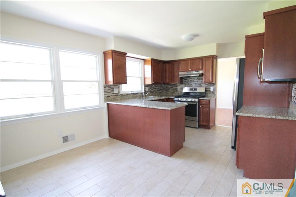 34 Taylor Road Princeton, NJ 08540 - Photo 3 of 14 a kitchen with stainless steel appliances granite countertop a stove a refrigerator a sink and a refrigerator