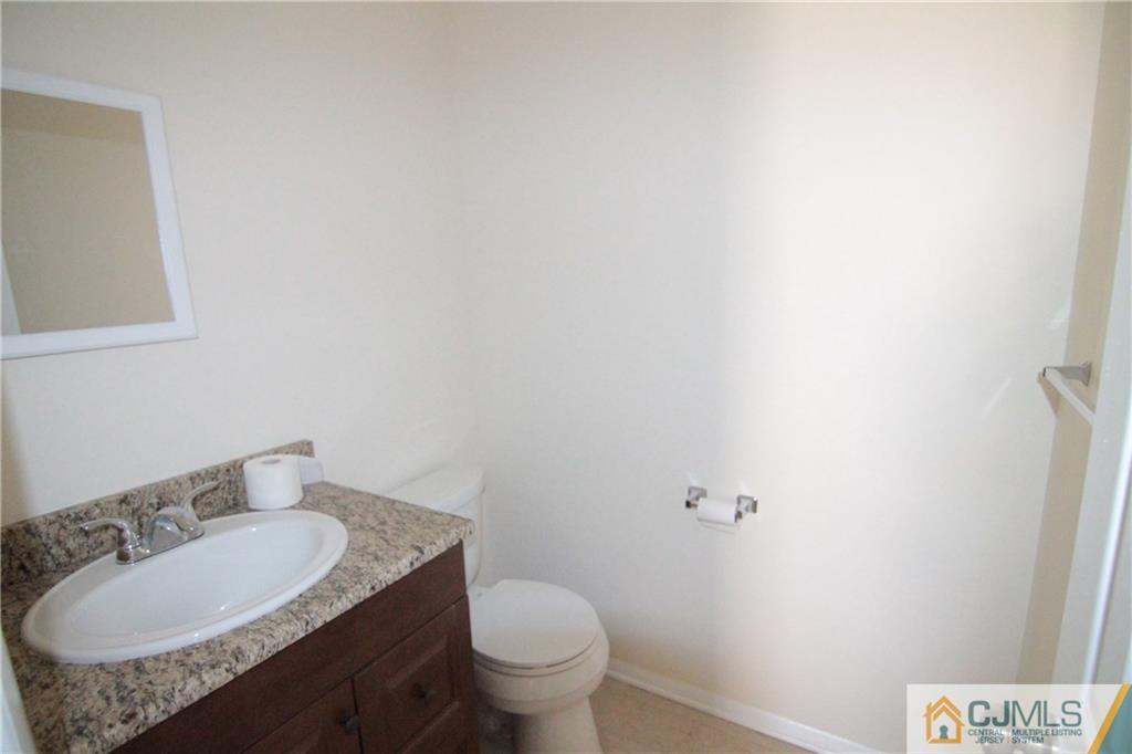 34 Taylor Road Princeton, NJ 08540 - Photo 8 of 14 a bathroom with a granite countertop sink and a mirror