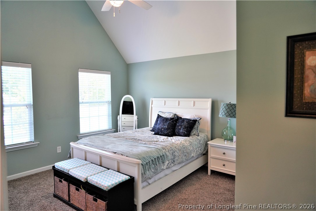 930 Old Vander Road Fayetteville, NC 28312 - Photo 32 of 45 a bedroom with a bed and wooden floor