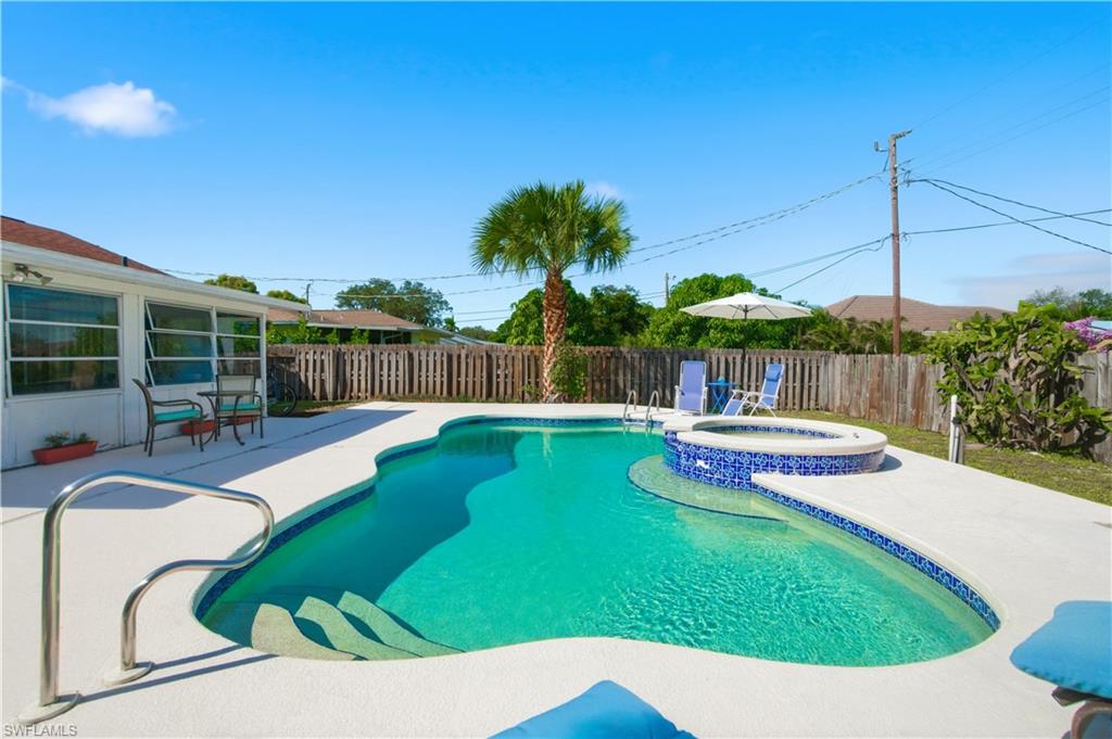 55 2nd Street Bonita Springs, FL 34134 - Photo 2 of 25 a view of a swimming pool with a patio