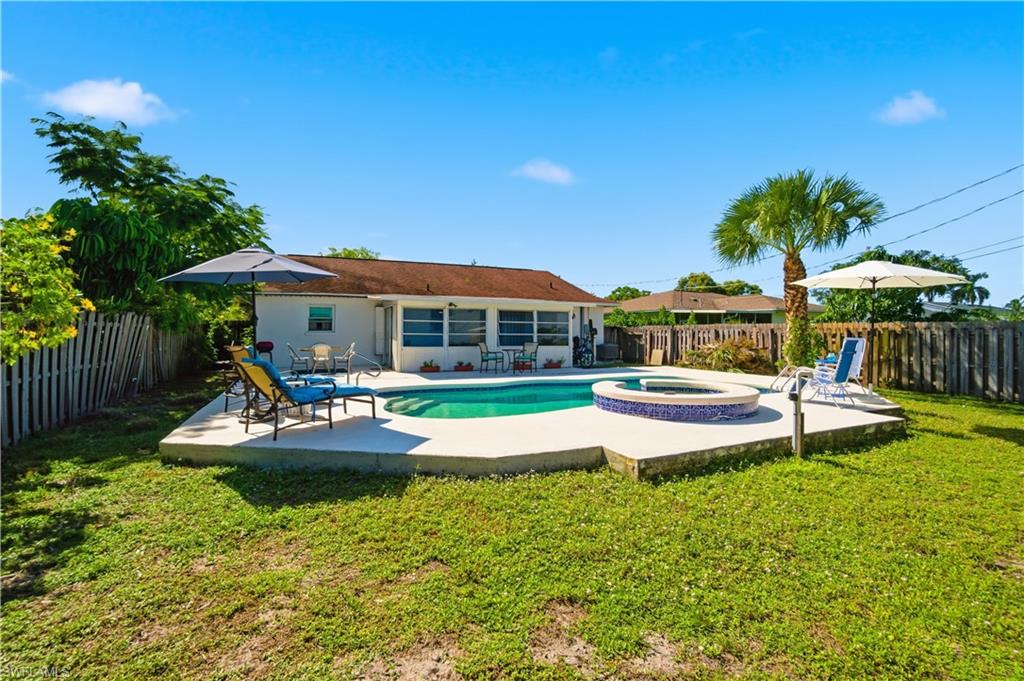 55 2nd Street Bonita Springs, FL 34134 - Photo 21 of 25 a view of house with swimming pool outdoor seating