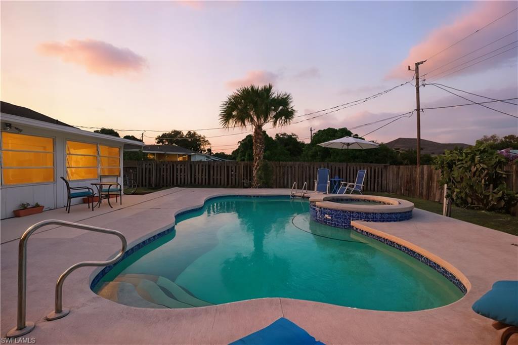 55 2nd Street Bonita Springs, FL 34134 - Photo 22 of 25 a view of a swimming pool with a patio