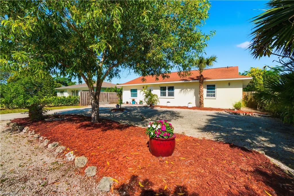 55 2nd Street Bonita Springs, FL 34134 - Photo 23 of 25 a view of a house with a yard