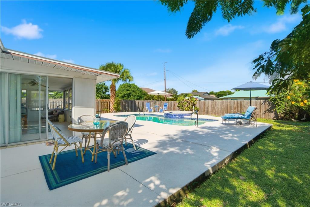 55 2nd Street Bonita Springs, FL 34134 - Photo 3 of 25 a view of a backyard with furniture and garden