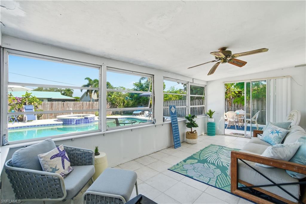 55 2nd Street Bonita Springs, FL 34134 - Photo 4 of 25 a living room with furniture and a large window