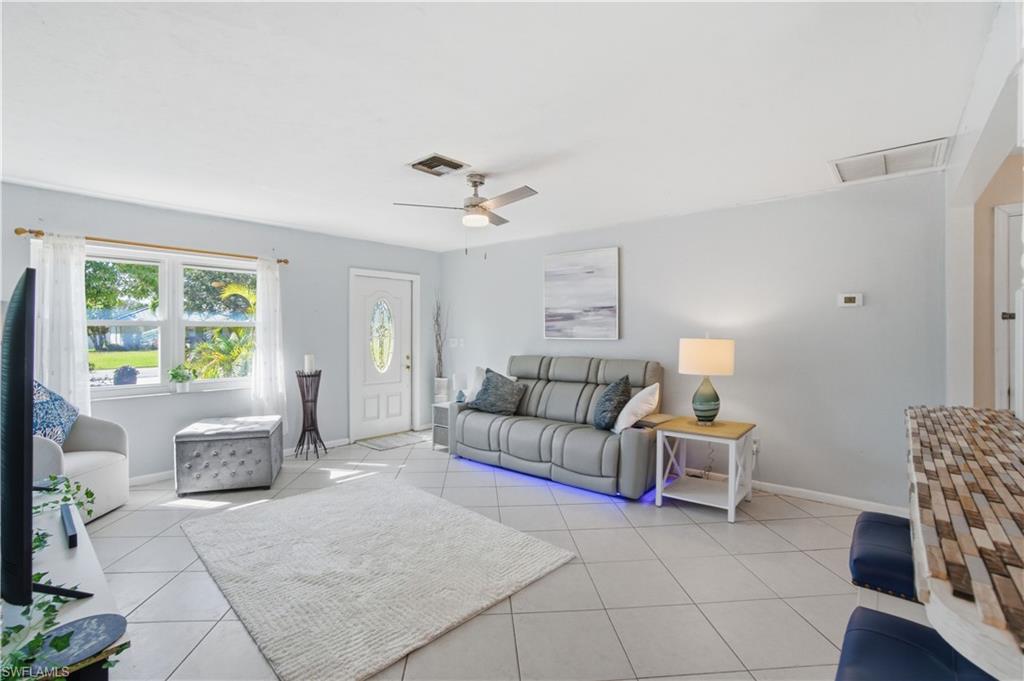 55 2nd Street Bonita Springs, FL 34134 - Photo 5 of 25 a living room with furniture and a table