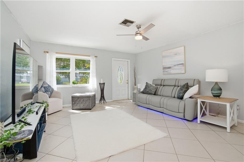55 2nd Street Bonita Springs, FL 34134 - Photo 10 of 25 a living room with furniture and a large window