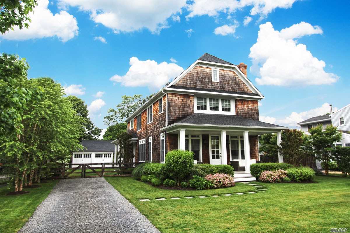 233 Sunset Avenue Westhampton Beach, NY 11978 - Photo 1 of 1 a front view of a house with a yard and potted plants
