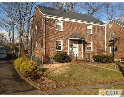 824 2nd Street, Unit 1 Dunellen, NJ 08812 - Photo 2 of 11 a front view of a house with a yard