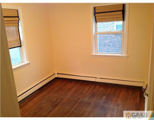 824 2nd Street, Unit 1 Dunellen, NJ 08812 - Photo 5 of 11 a view of an empty room with a window