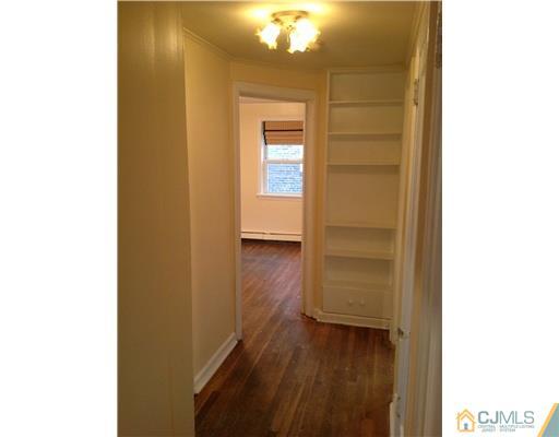 824 2nd Street, Unit 1 Dunellen, NJ 08812 - Photo 7 of 11 a view of a hallway with wooden floor