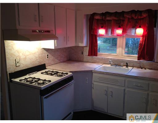 824 2nd Street, Unit 1 Dunellen, NJ 08812 - Photo 8 of 11 a kitchen with a sink cabinets and window