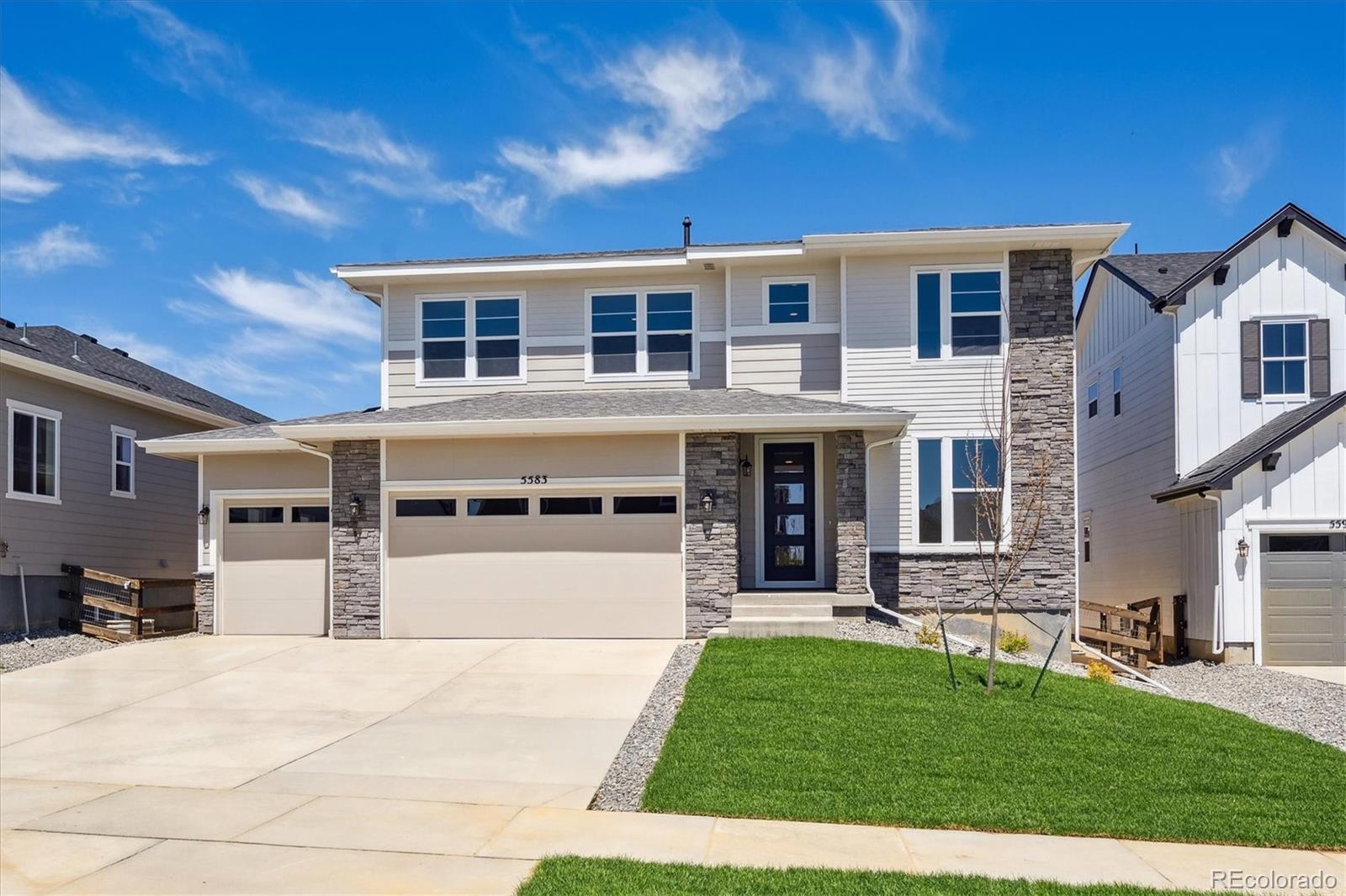 a front view of a house with a yard