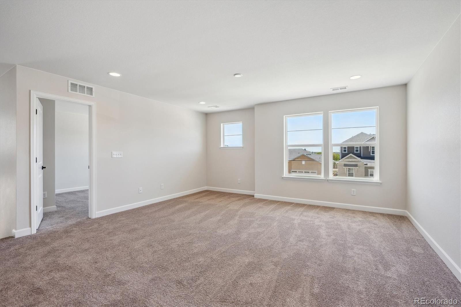 5583 Riverbend Avenue Firestone, CO 80504 - Photo 12 of 25 a view of an empty room with a window