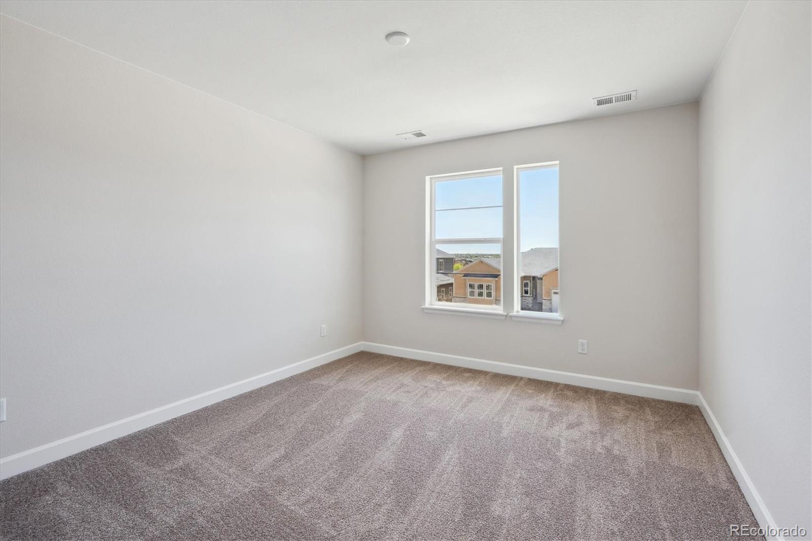 5583 Riverbend Avenue Firestone, CO 80504 - Photo 13 of 25 an empty room with a window