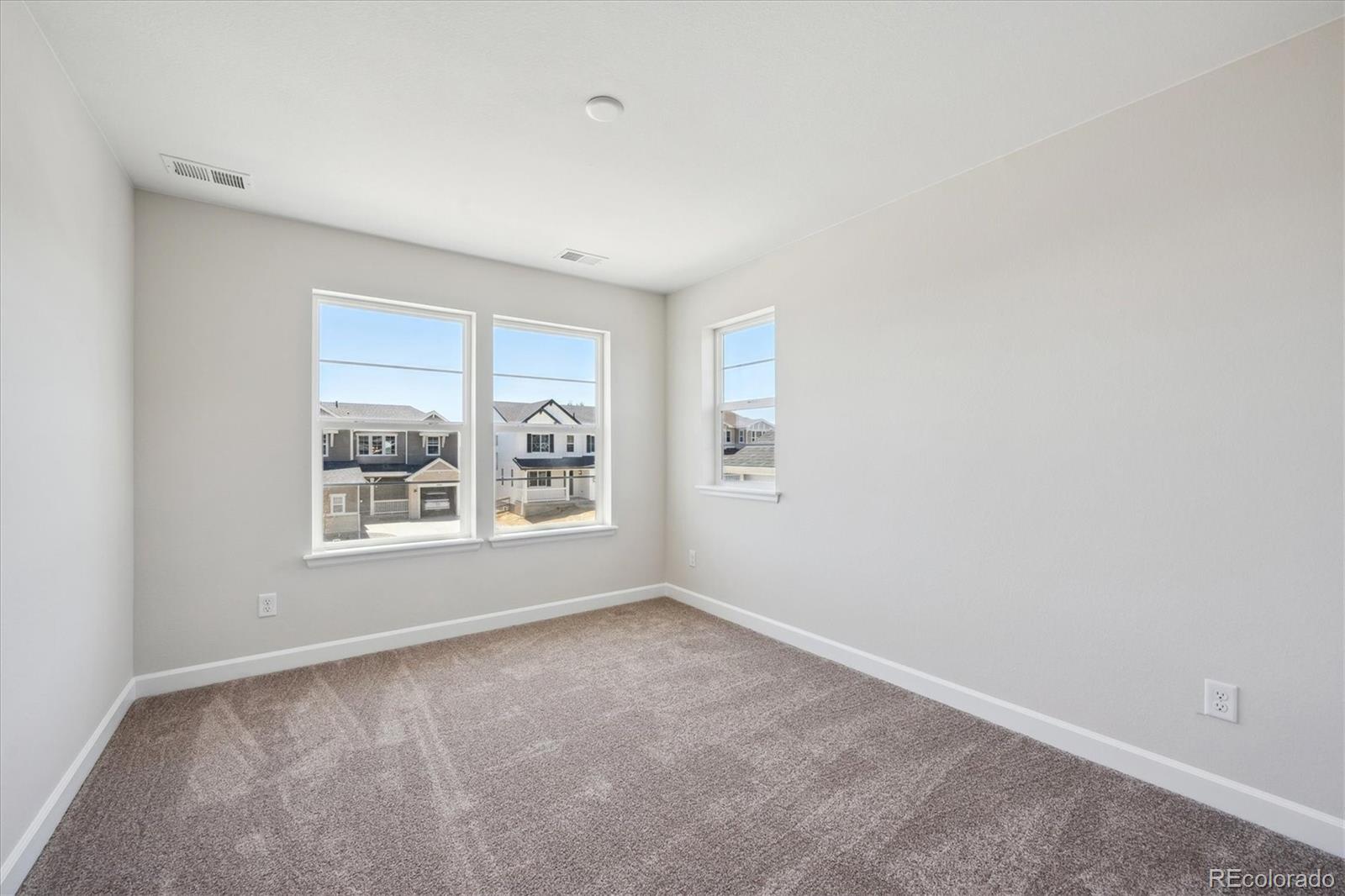 5583 Riverbend Avenue Firestone, CO 80504 - Photo 14 of 25 an empty room with windows