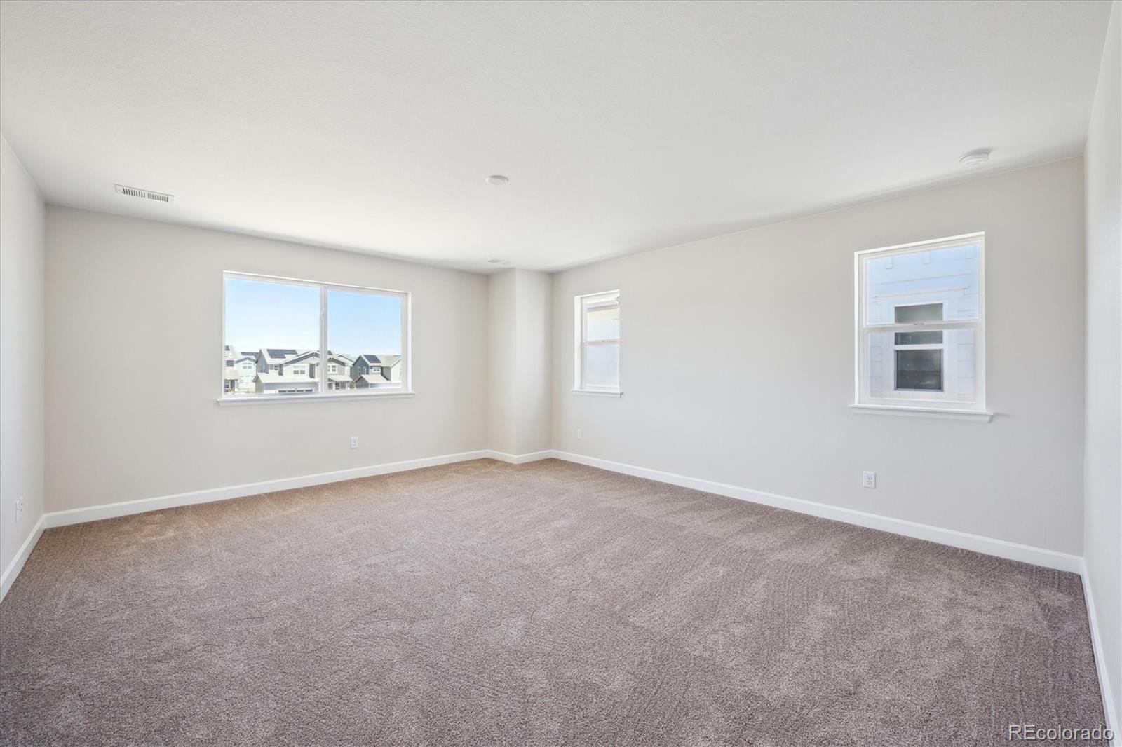5583 Riverbend Avenue Firestone, CO 80504 - Photo 18 of 25 an empty room with windows