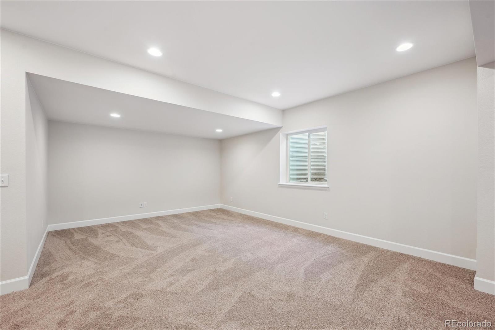 5583 Riverbend Avenue Firestone, CO 80504 - Photo 22 of 25 an empty room with windows