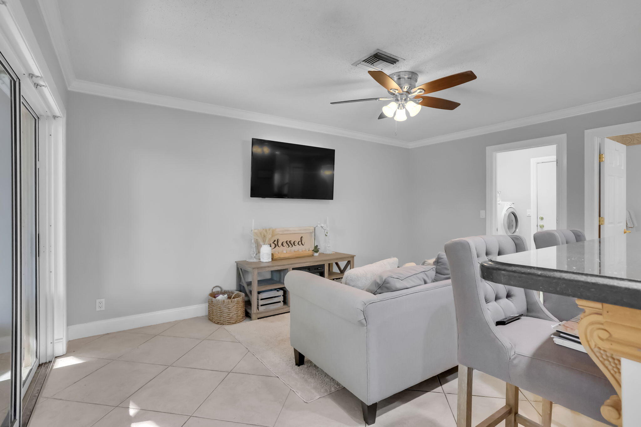 7424 Ashley Shores Circle Lake Worth, FL 33467 - Photo 12 of 33 a living room with furniture and a flat screen tv