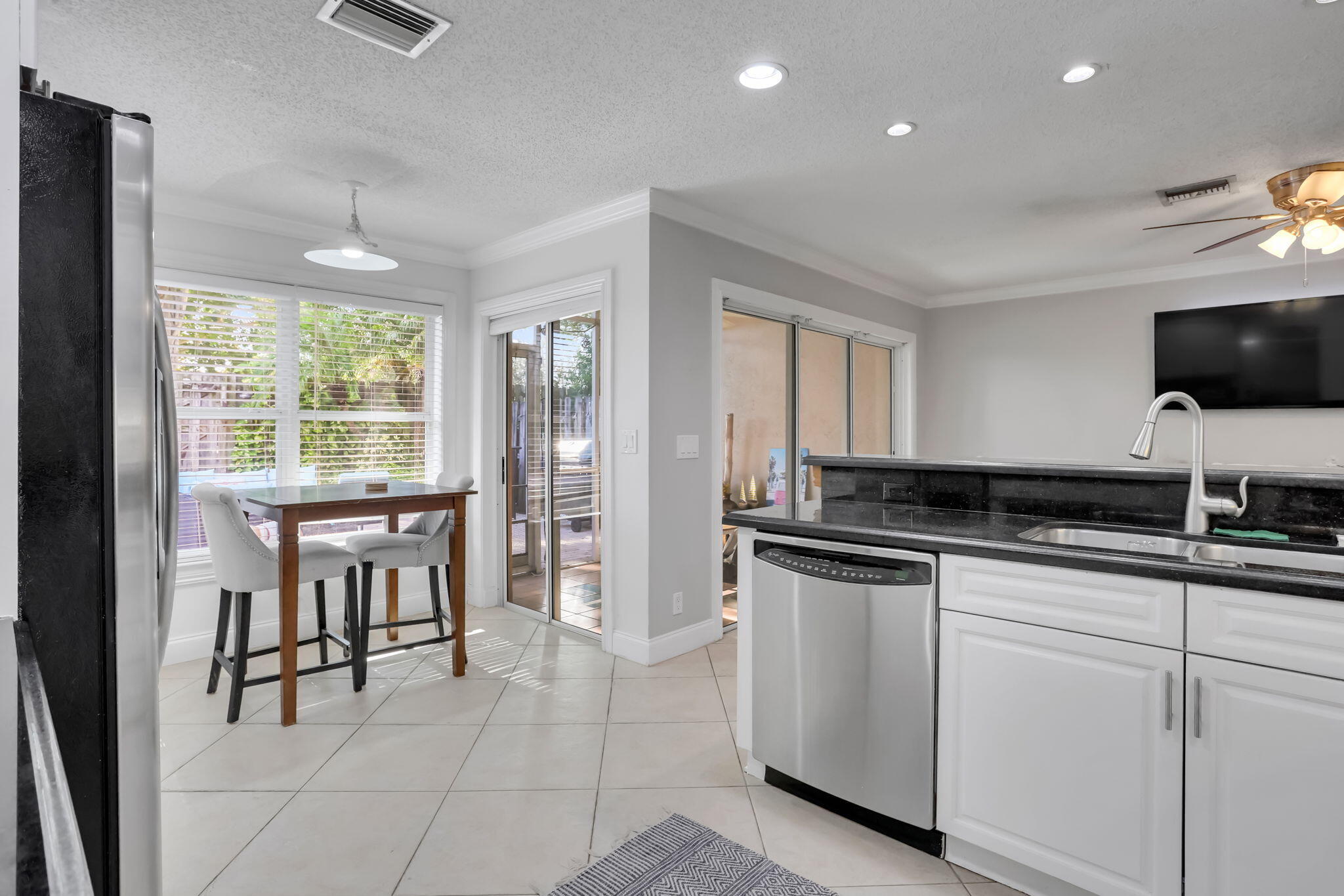 7424 Ashley Shores Circle Lake Worth, FL 33467 - Photo 16 of 33 a kitchen with stainless steel appliances granite countertop a stove and a sink