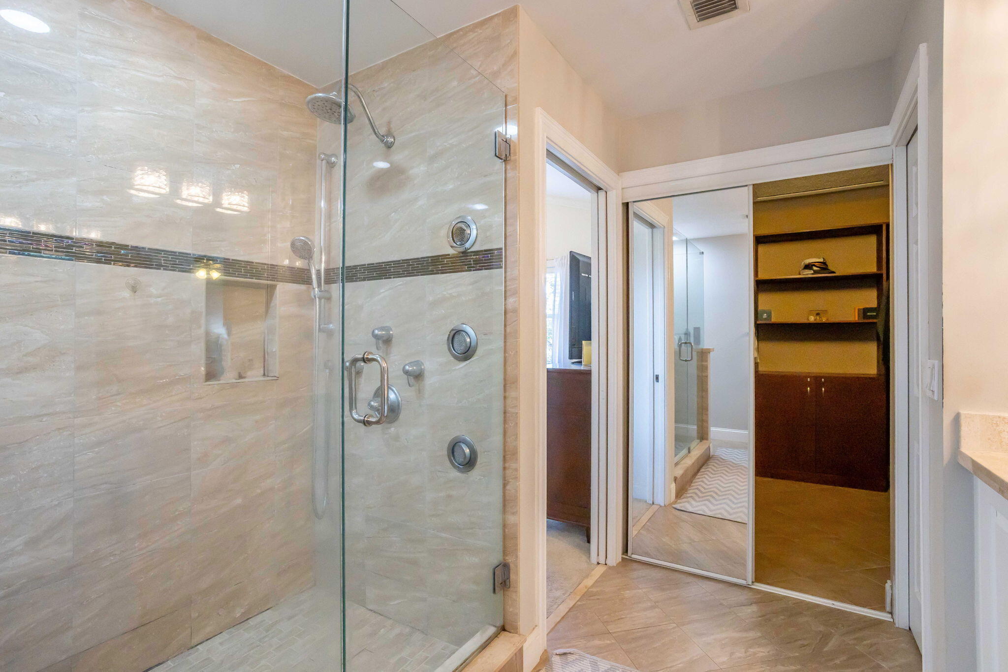 7424 Ashley Shores Circle Lake Worth, FL 33467 - Photo 21 of 33 a bathroom with a shower and a glass door