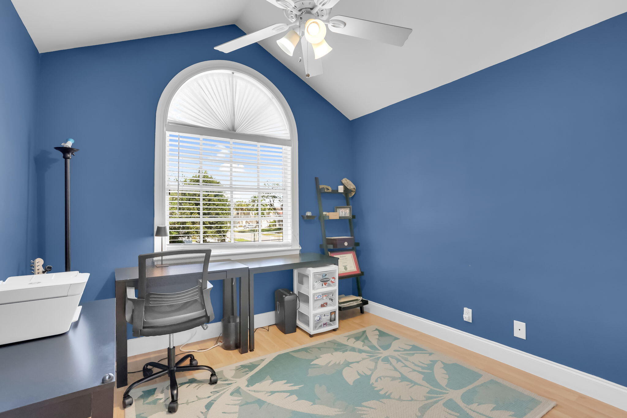 7424 Ashley Shores Circle Lake Worth, FL 33467 - Photo 25 of 33 a bedroom with a bed and a chandelier