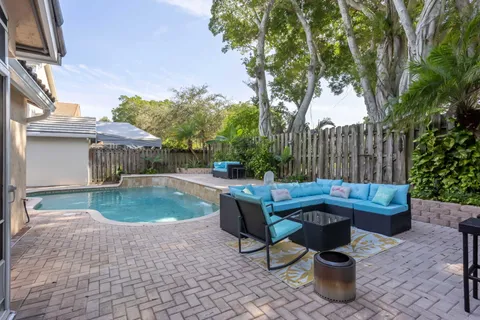 a view of a backyard with sitting area and furniture