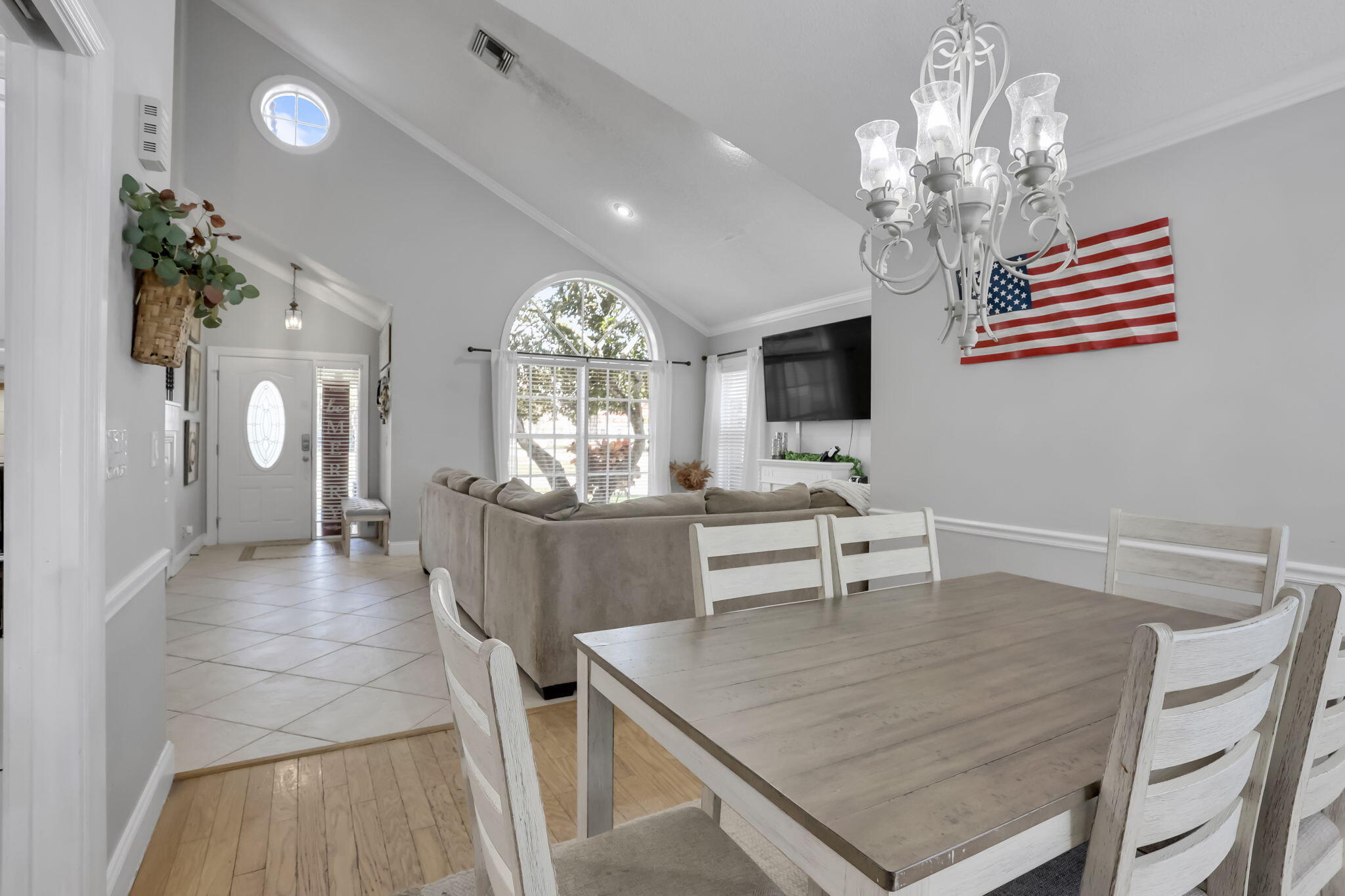 7424 Ashley Shores Circle Lake Worth, FL 33467 - Photo 6 of 33 a view of a dining room with furniture and chandelier