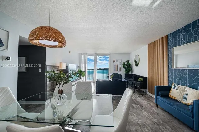 a living room with furniture or couch and a potted plant