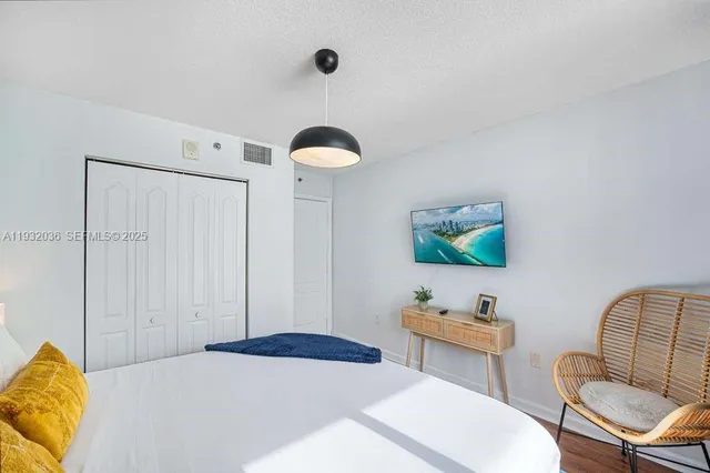 a bedroom with a bed and furniture