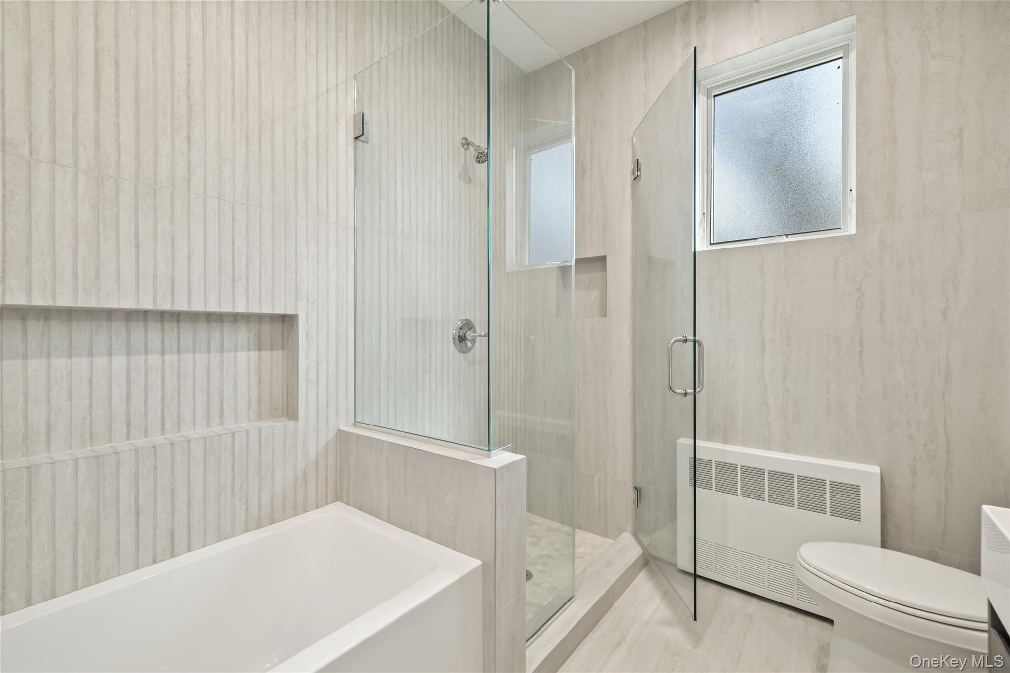 5 Mirror Lake Road, Unit 202 Spring Valley, NY 10977 - Photo 24 of 50 a bathroom with a bathtub and a shower
