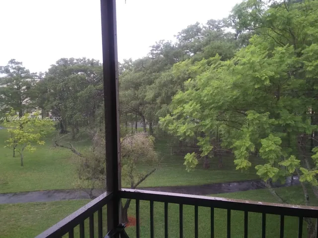 a view of a balcony with an outdoor space