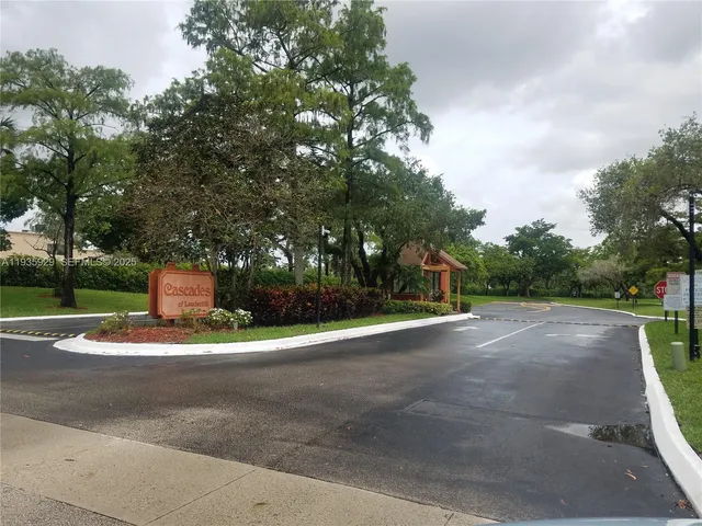 a view of a park with large trees
