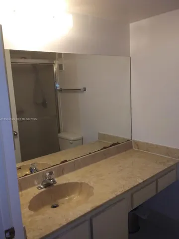 a bathroom with a sink and mirror