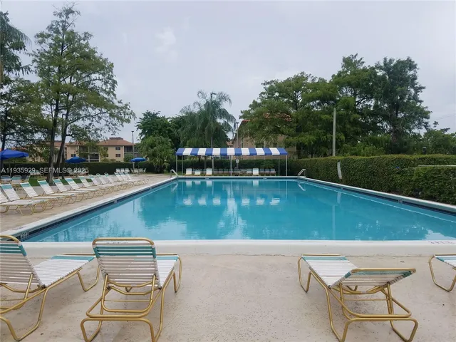 a view of swimming pool with a yard